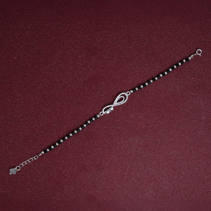 Chic black beaded silver bracelet with a classic infinity design for a stylish look