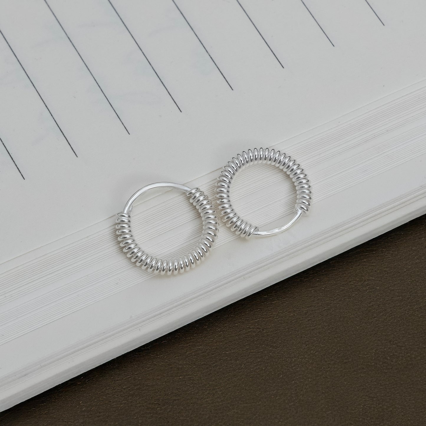 Elegant Coiled Design Silver Hoops