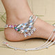 Silver anklets featuring a peacock design with colorful stones