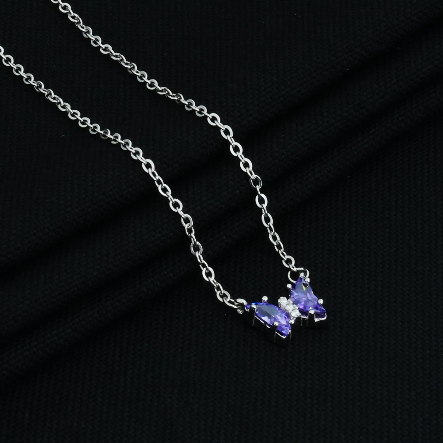 Blue butterfly pendant on a sleek sterling silver chain