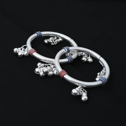 Charming silver baby kada with beautiful pink and blue charms