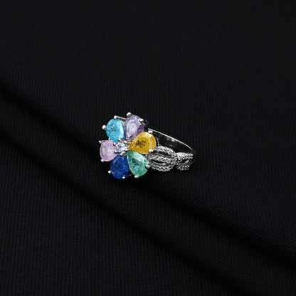 Stylish silver ring with a colorful flower and leaf pattern, offering a playful yet elegant touch to any outfit.