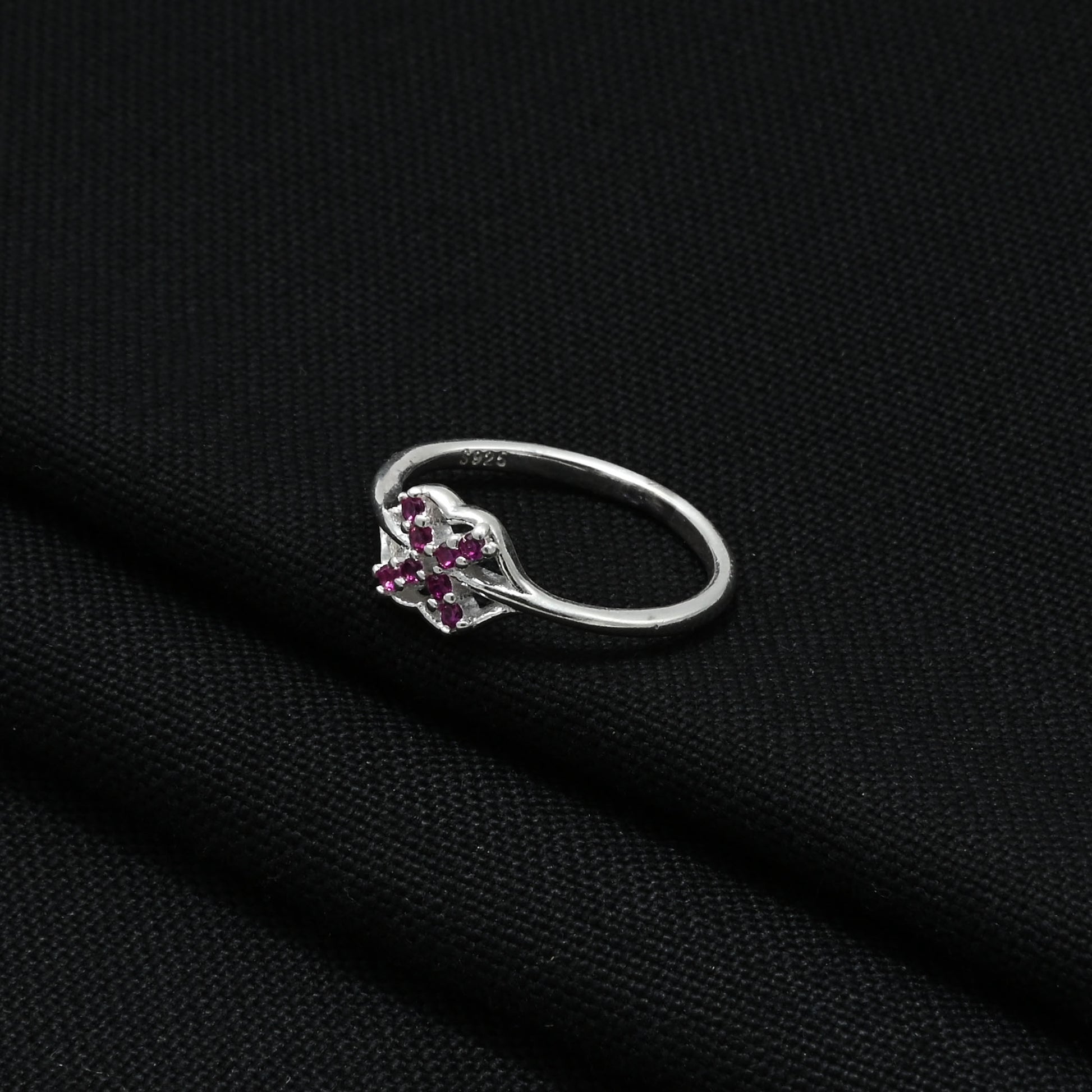 Stylish silver girls' ring showcasing minimal pink gemstones for a sleek look