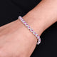 Elegant silver bracelet adorned with a pink gemstone, perfect for women seeking timeless style.