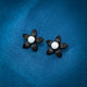 Stunning black flower-shaped earrings with a pearl accent in sterling silver