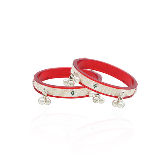 Exquisite silver bridal bangles with rich red accents, designed to add a touch of elegance and tradition to your wedding look
