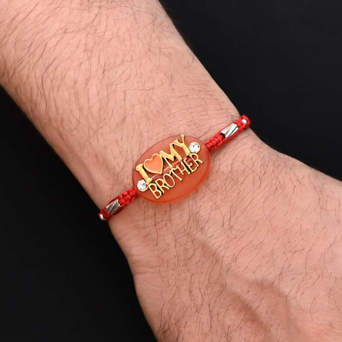Elegant Rakhi with 'I Love My Brother' written in silver, ideal for boys