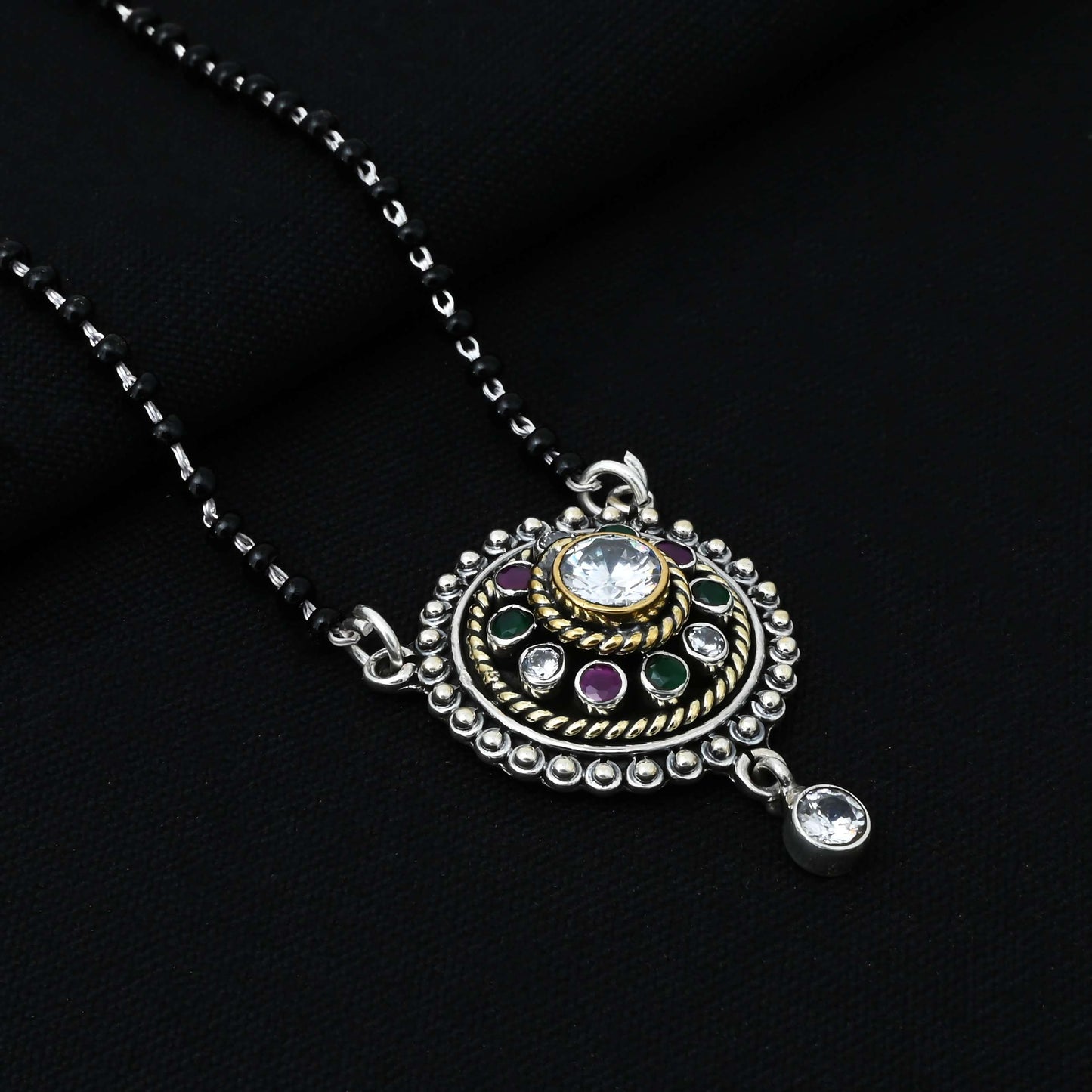 Chic sterling silver mangalsutra adorned with round stones in a delicate flower motif