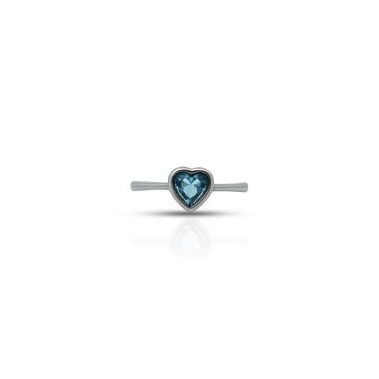 Elegant silver ring featuring blue topaz heart, perfect for girls.