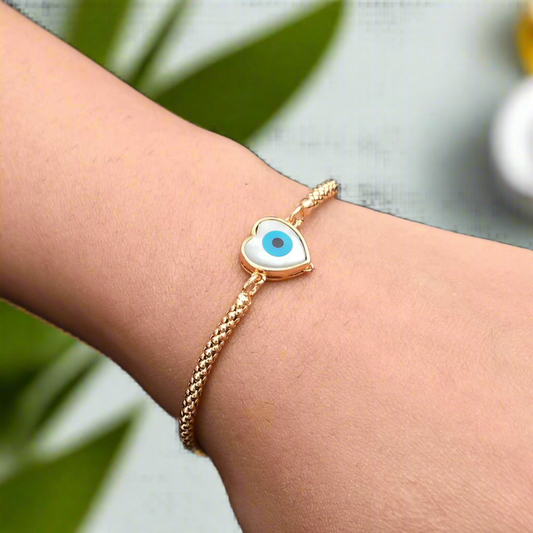 Sterling silver bracelet for girls featuring a protective evil eye and heart design