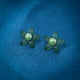 Charming green flower-shaped stud earrings with pearl center in sterling silver