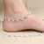 Ethnic silver anklet featuring charming shell-shaped accents.