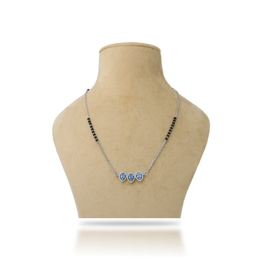 Elegant silver mangalsutra for women featuring a stunning designer blue stone centerpiece