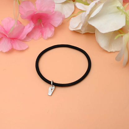A stylish bracelet featuring a shiny silver Knife charm