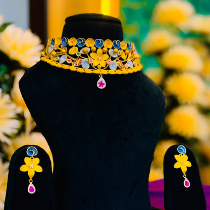 Timeless Beauty Gold Polish Silver Necklace with Gold Flower Center, Colorful Stones, and Leaf Accents.