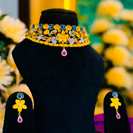 Timeless Beauty Gold Polish Silver Necklace with Gold Flower Center, Colorful Stones, and Leaf Accents.