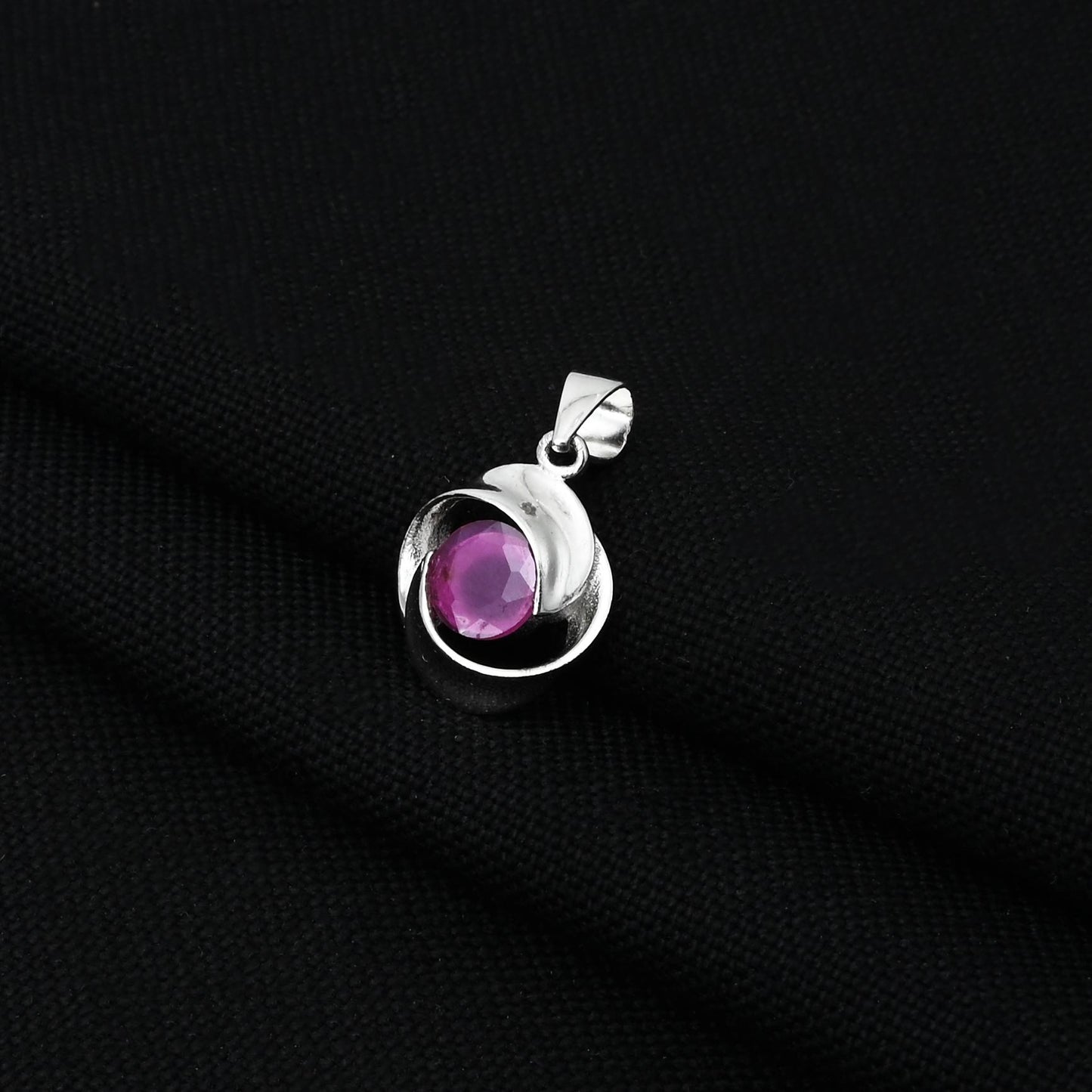 925 silver pendant with a unique pink gemstone and spiral pattern