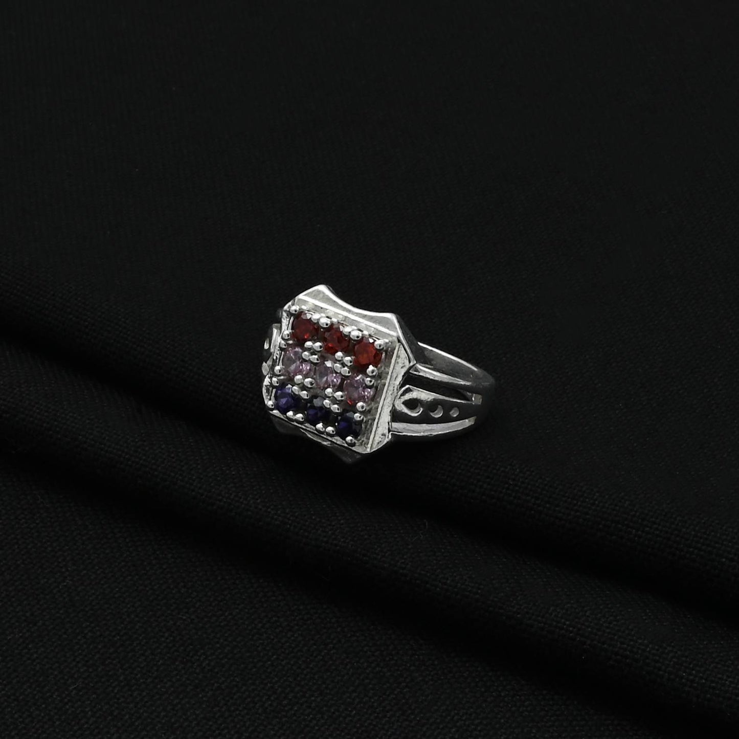 Sophisticated men's ring with an eye-catching design, showcasing a variety of colorful gemstones.