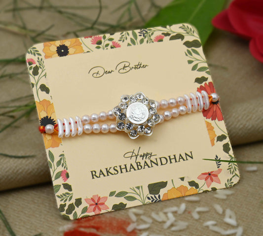 Silver center Ganesh Ji design with pearls, perfect Rakhi for boys