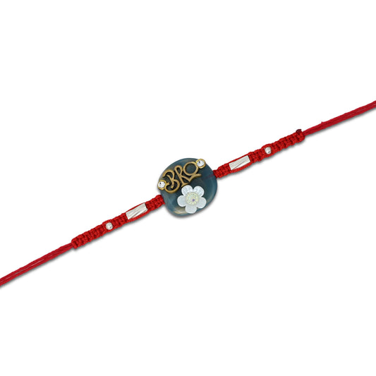 Boys' Rakhi featuring a silver 'Bro' centerpiece with a blue background and a white flower accent