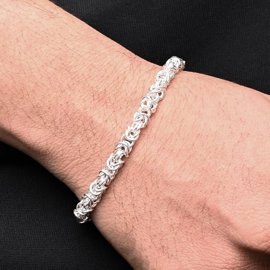 Premium men's silver chain bracelet with an intricate braided design for a bold look.