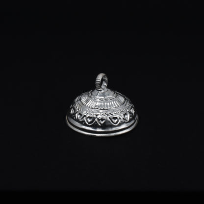 Close-up of the intricately designed silver chattar, perfect for temple rituals.