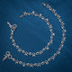 Elegant silver anklet with culturally inspired shell-shaped charms.