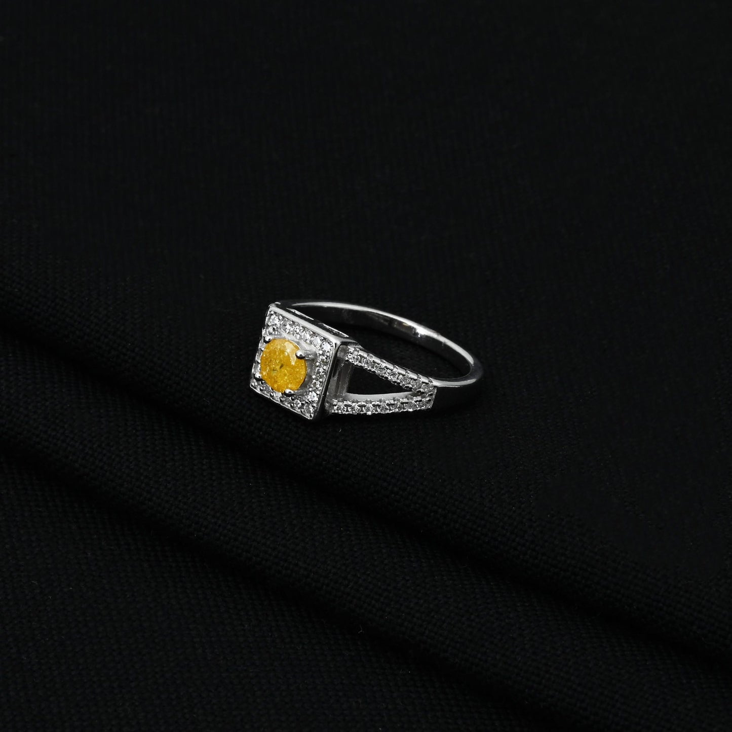 Elegant 925 silver girls' ring with a halo setting and a sparkling golden yellow gem.