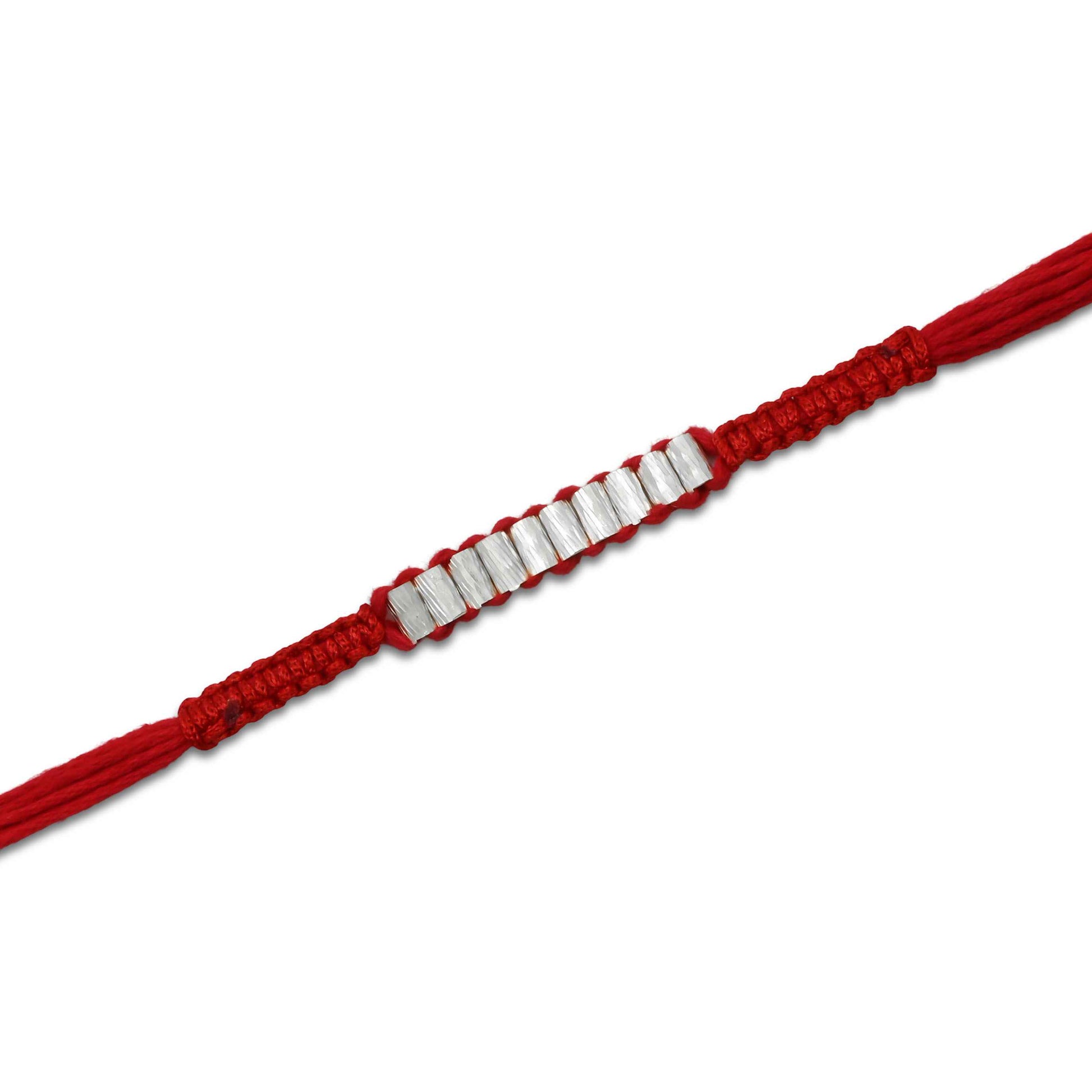 Boys' Rakhi featuring multiple silver cylinder-shaped beads for a unique design.