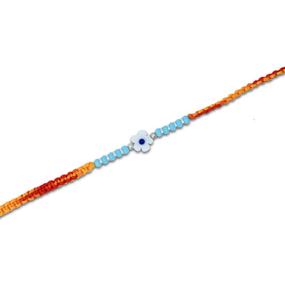 Boys' Rakhi featuring a silver flower centerpiece in light blue with matching beads.