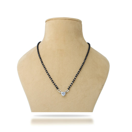 Elegant silver mangalsutra featuring a heart design with black beads for a romantic look