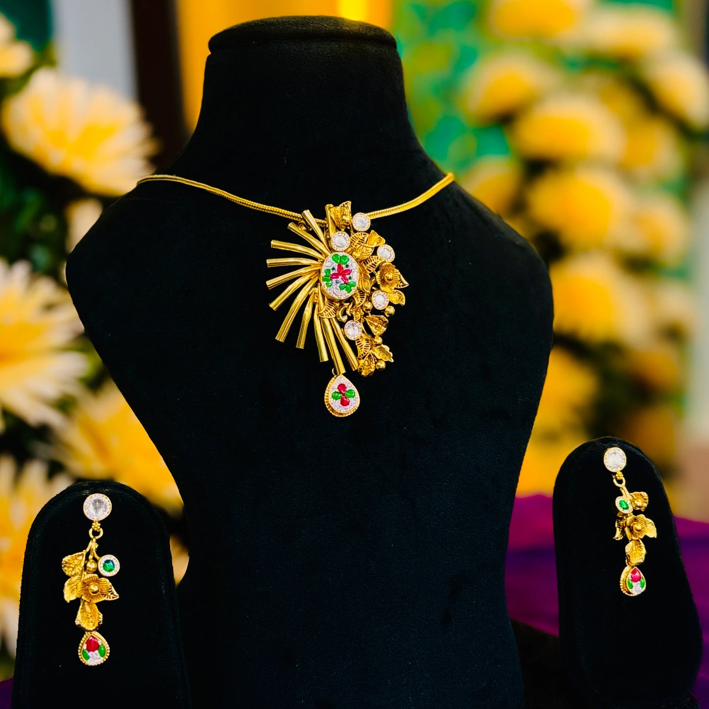 Glamorous Gold Polish Silver Necklace Set with Floral Center and Pink, White, Green Stone Embellishments.