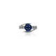 Elegant Silver Ring with Blue Stone and White Stone Detail.