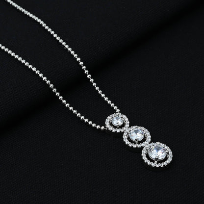 Elegant silver chain featuring a triple cubic zirconia pendant.