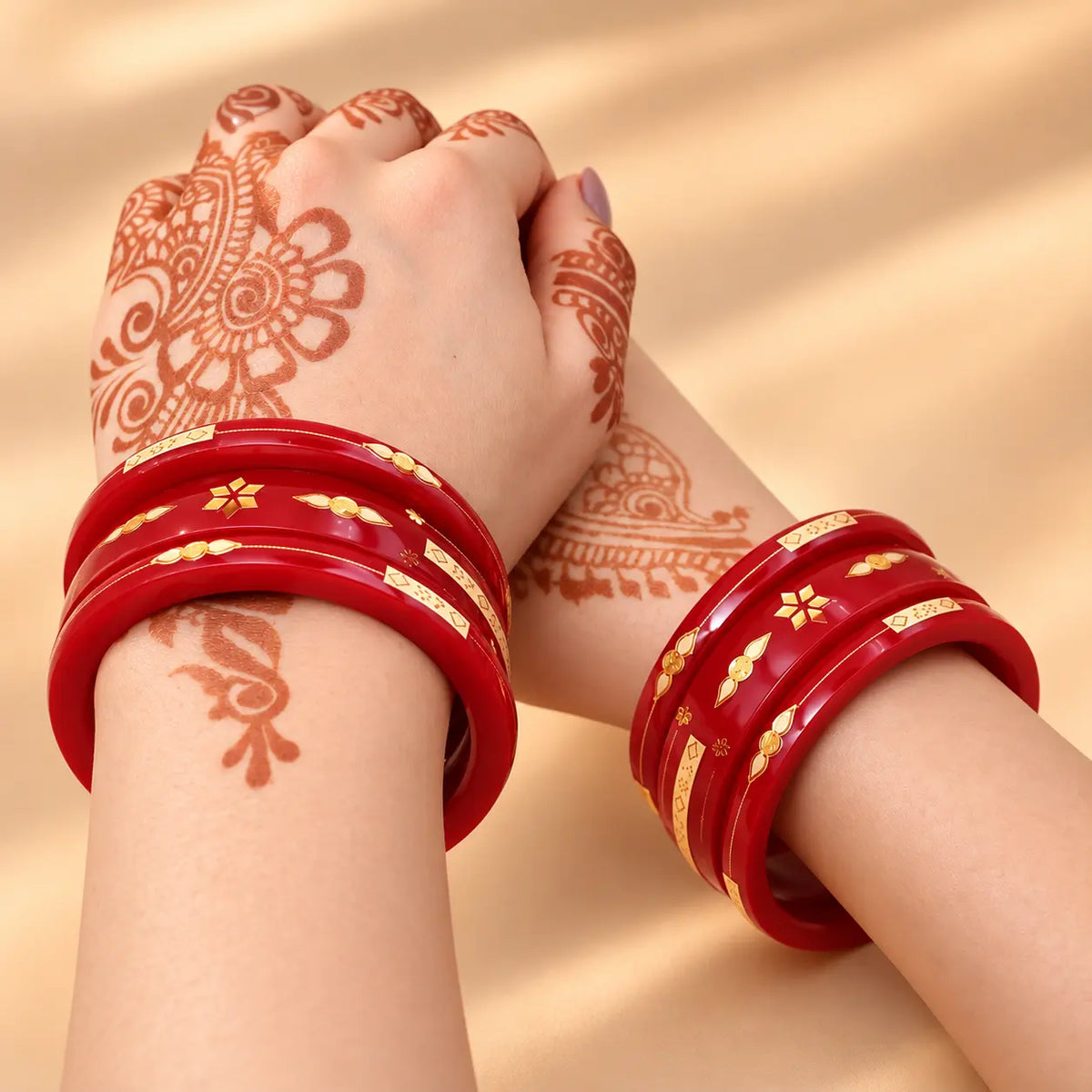 Red Gold Bangle Set Featuring Swastika Design – Stylish & Cultural.