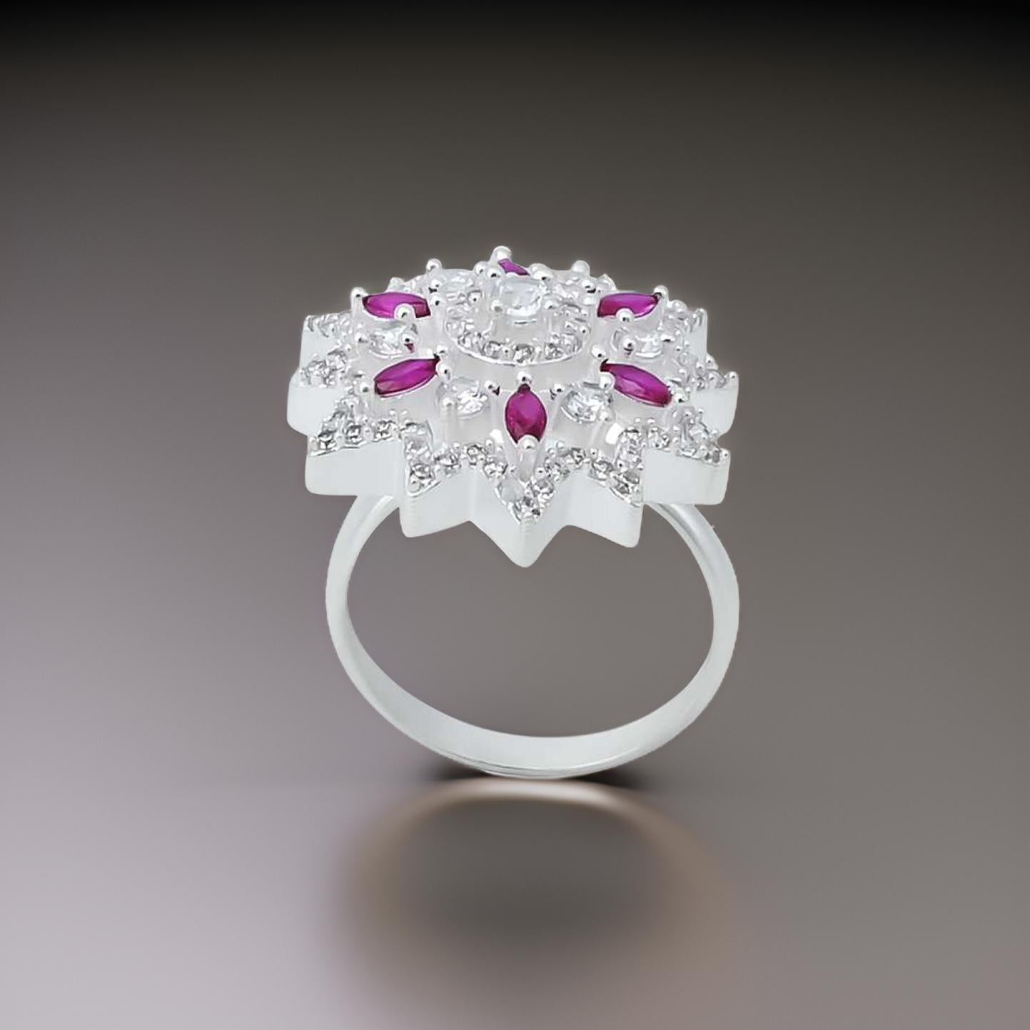 Elegant silver ring for girls showcasing a round pink gemstone set in a floral motif.