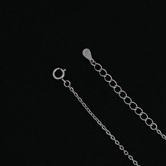 Elegant silver pendant necklace with personalized 'R' design.