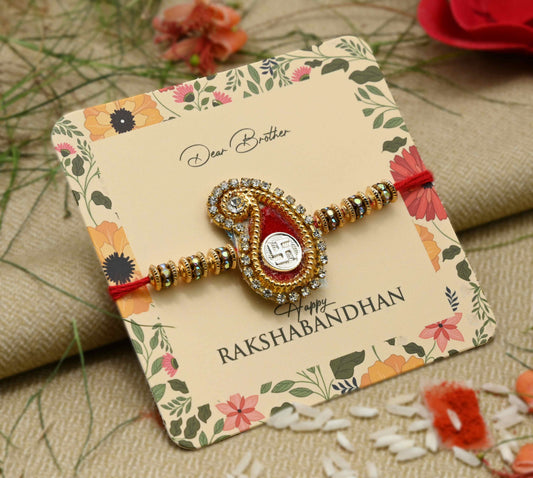 Silver center Swasthik design with a red theme and multiple colorful beads, perfect Rakhi for boys.