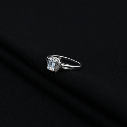 Stylish silver ring with rectangular blue stone and CZ accents.