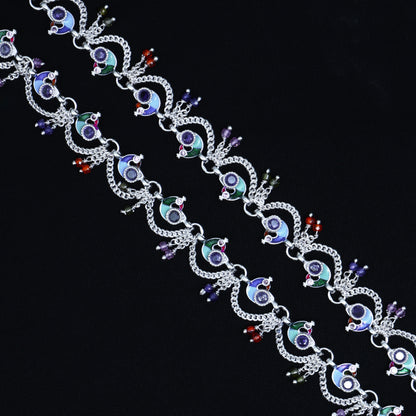 Silver anklet with a beautiful sequence of colorful peacock patterns, perfect for a festive touch