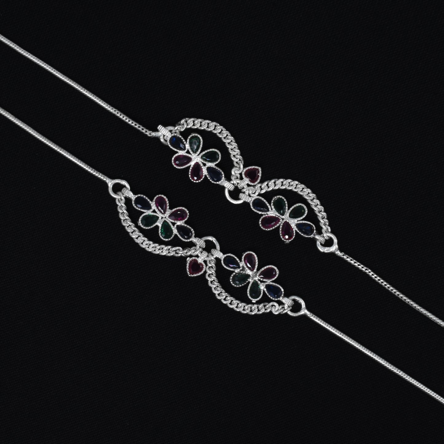 Silver payal adorned with chains and shimmering gems for a sophisticated look