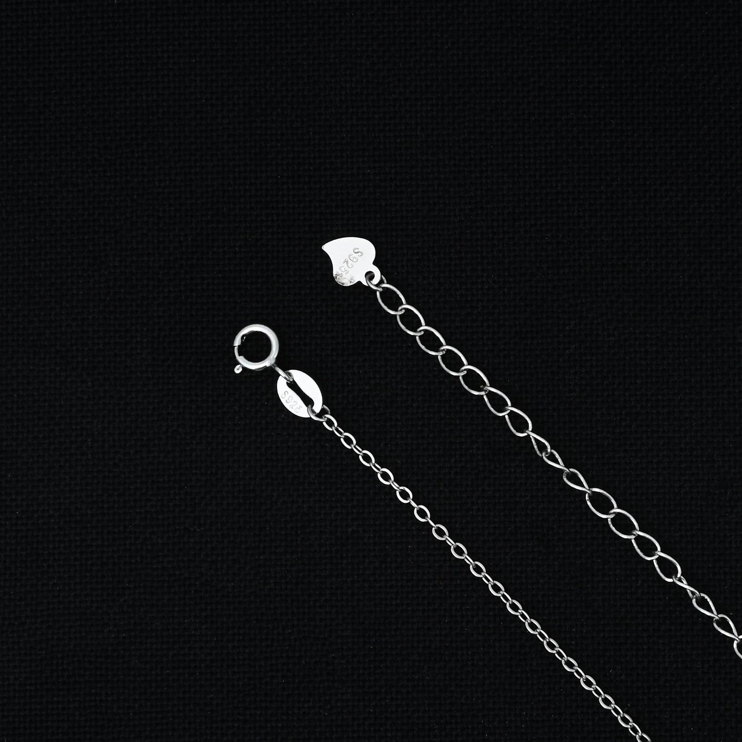 Elegant silver chain featuring a unique pendulum design pendant.