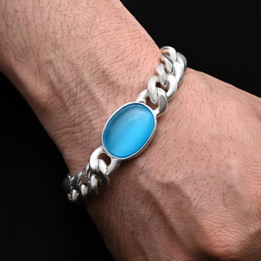 Men's silver chain bracelet with a bold center blue stone