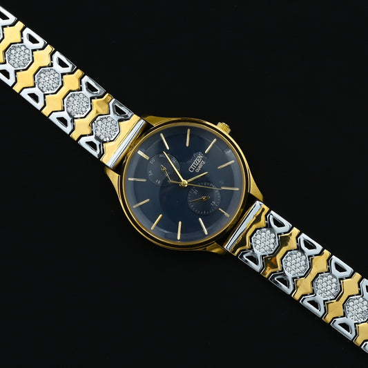 Elegant gold-plated silver watch featuring white stones.