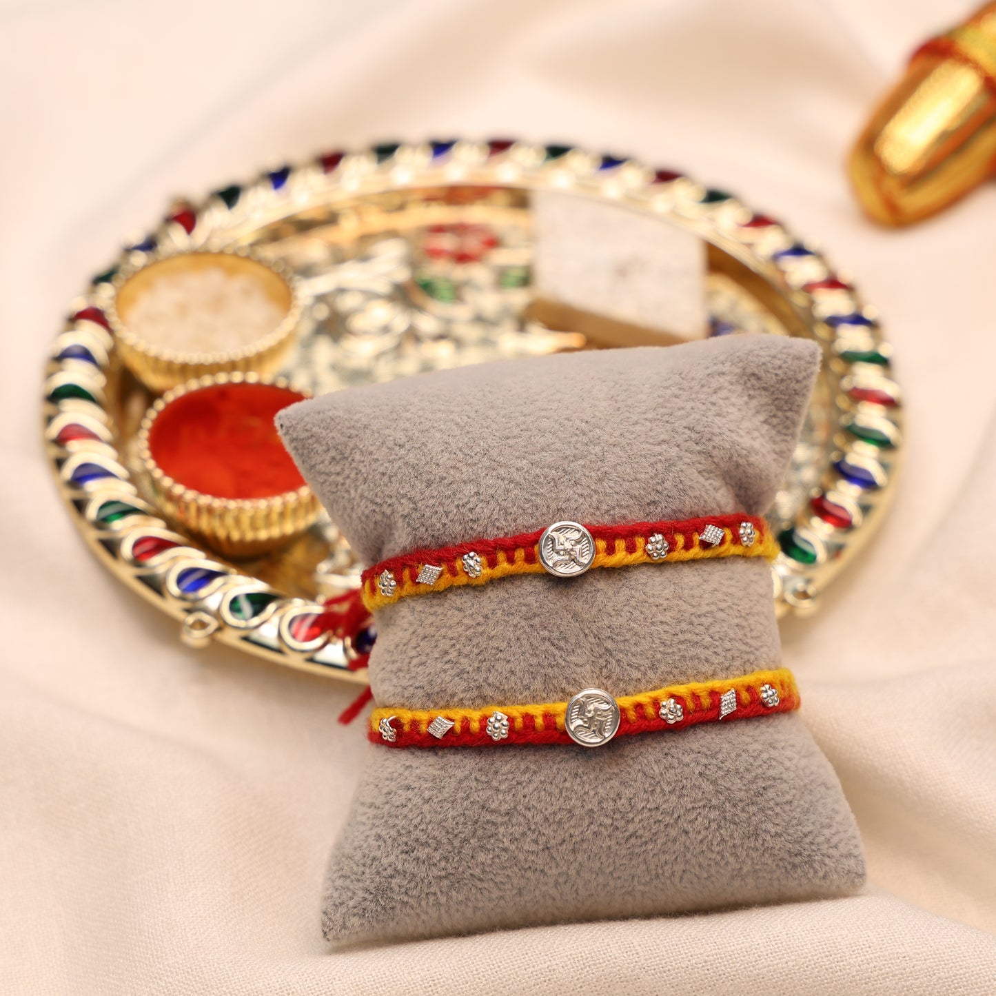 Swastik Charm Rakhi in Silver