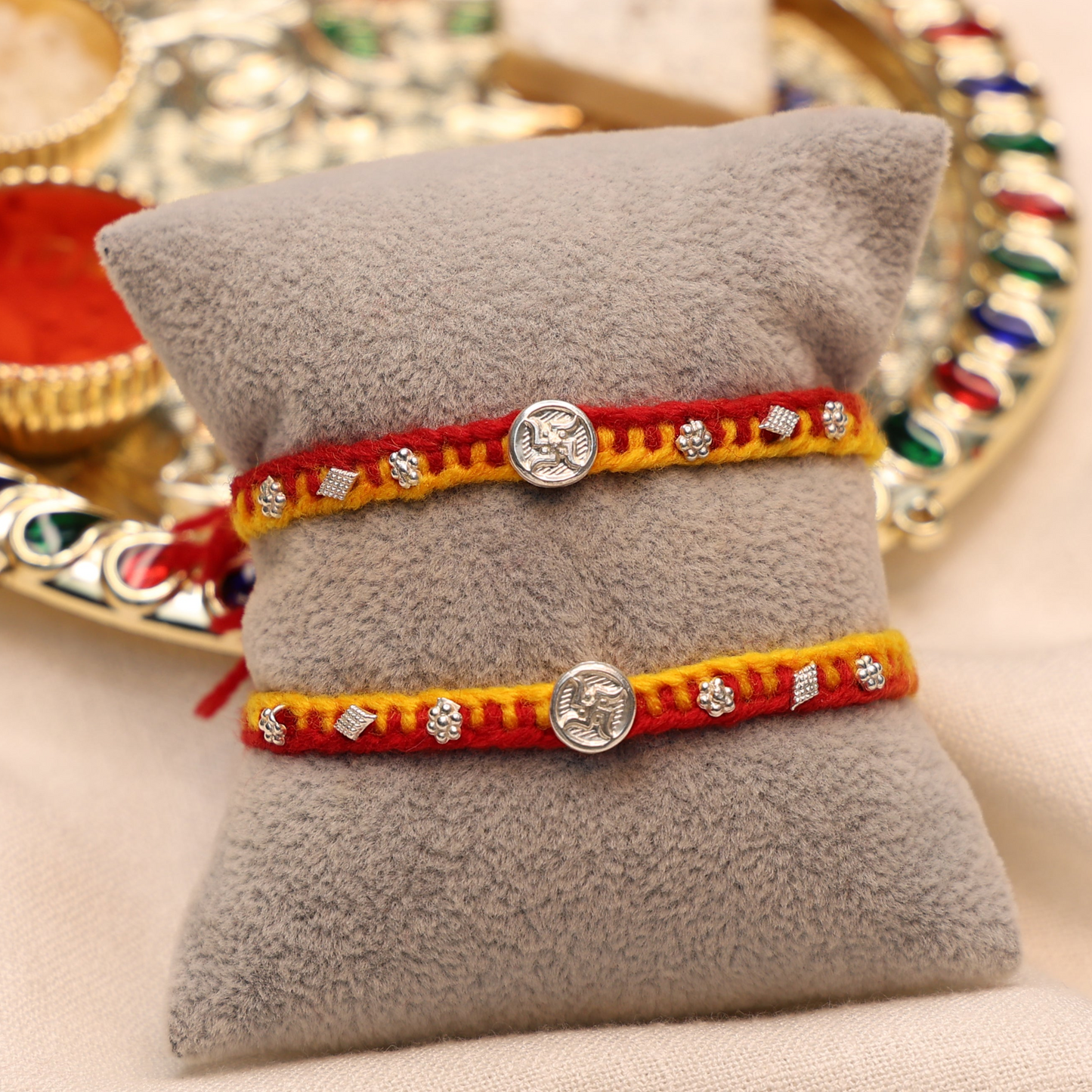 Swastik Charm Rakhi in Silver