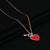 Elegant red heart pendant in rose gold plating on a fine chain