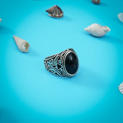 Charming silver ring with a classic oval-shaped black stone in traditional style