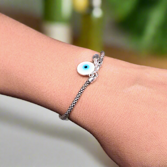 Fabulous silver bracelet featuring a protective evil eye charm