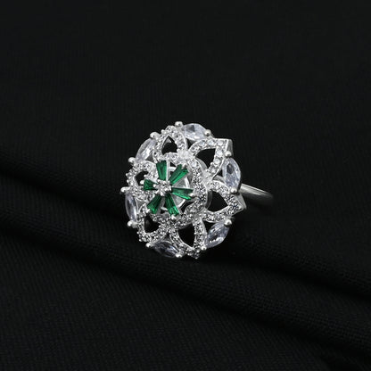 Stylish silver ring with dazzling green and white stones, adding a touch of luxury and charm to any outfit.